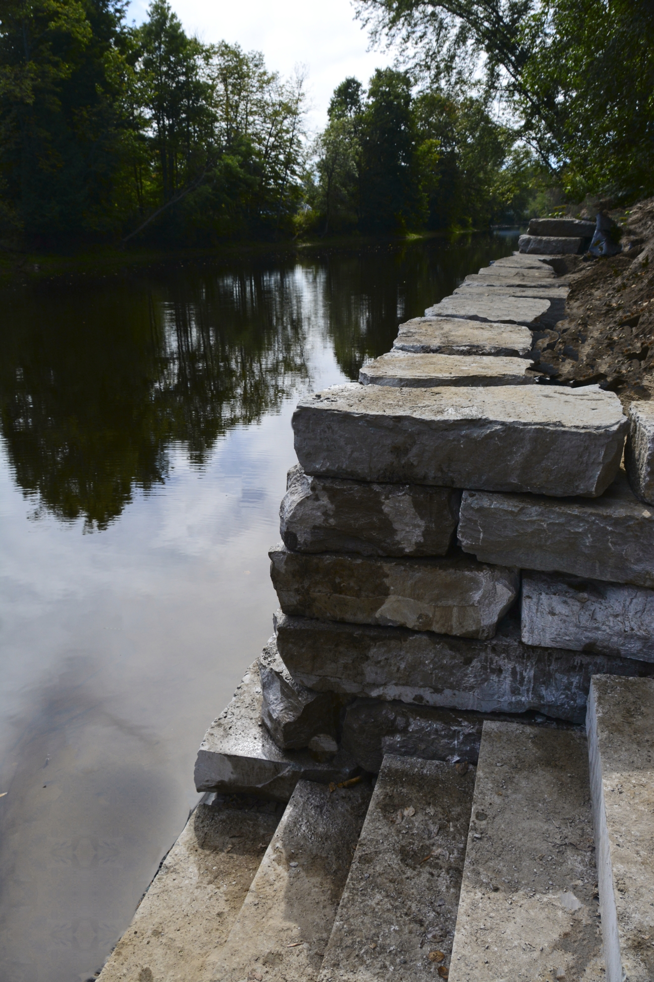Retaining Wall built with J.C. Rock Perfect Fit Armour Stone at river access stair case